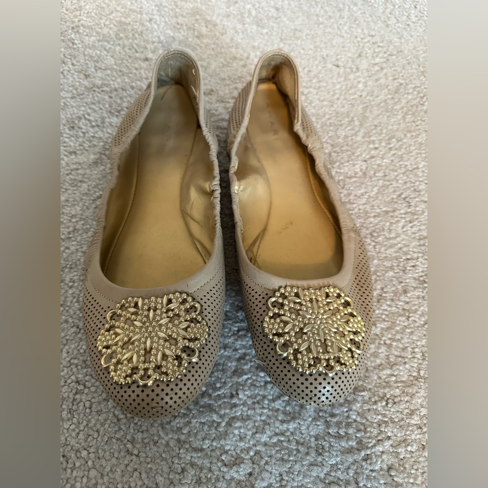 Tan and gold flats